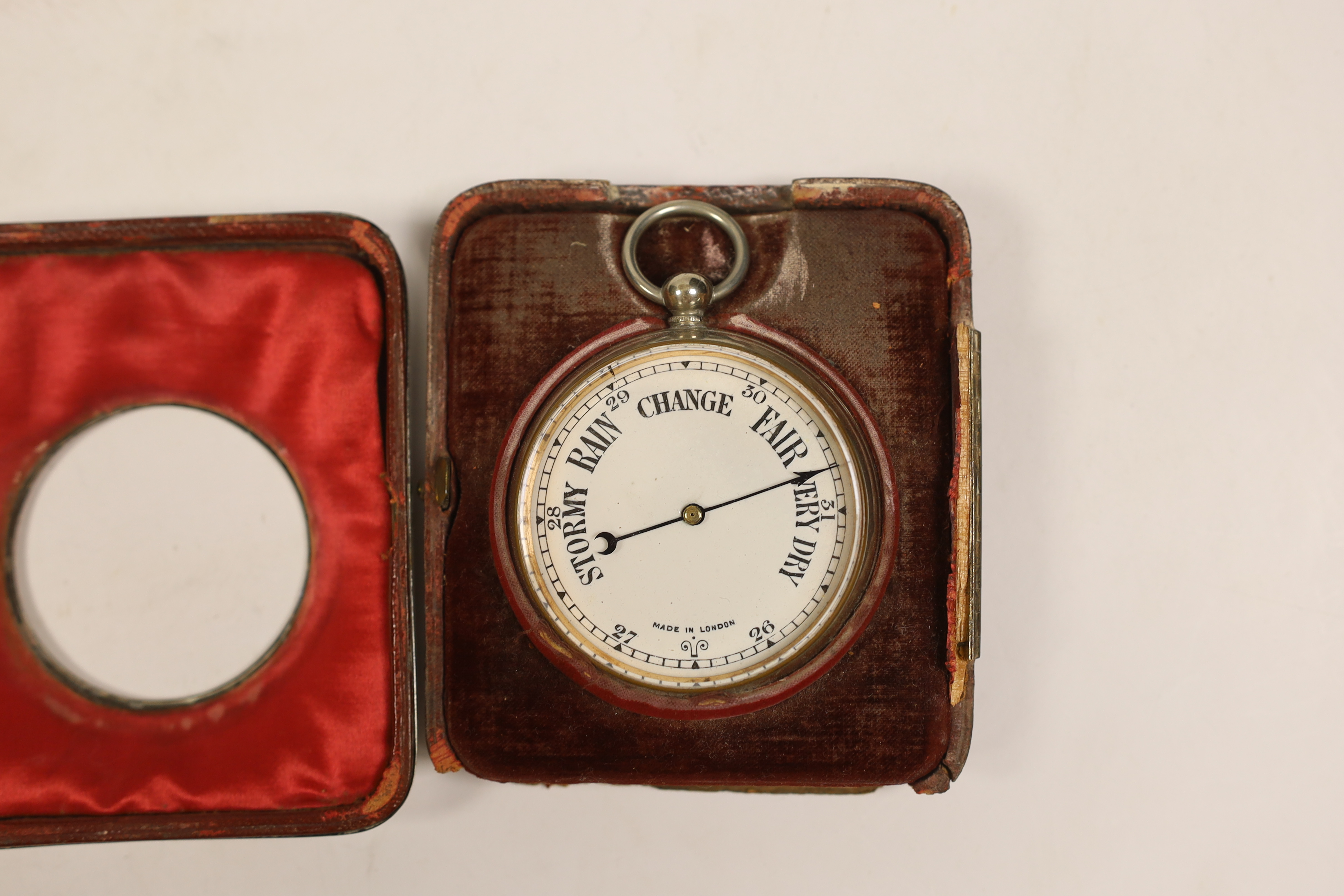 A nickel cased Goliath pocket barometer, in silver mounted travelling case, London, 1897, 11.1cm.